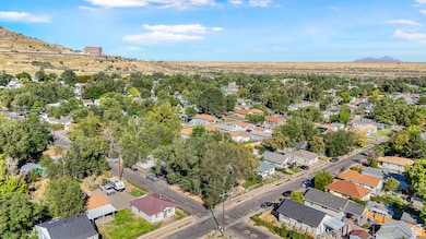 Aerial perspective of suburban area featuring a mountain backdrop