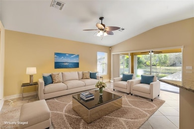 Living area with light tile patterned floors, visi