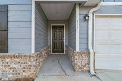 Entrance to property with a garage