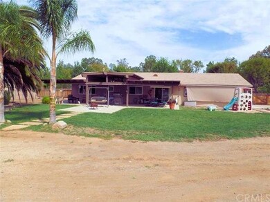 Rear of home with permitted patio cover and Bull B