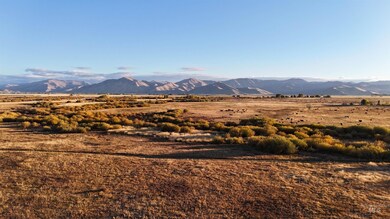 View of mountain backdrop with rural landscape