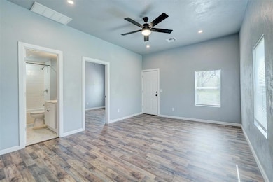 Unfurnished bedroom featuring wood finished floors