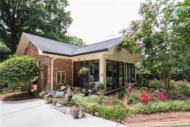 Back entrance through fabulous glassed-in porch. E