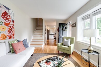 Living room with light hardwood / wood-style floor