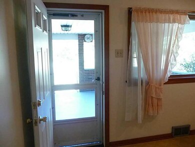 Kitchen. Side entry from porch to eat in kitchen.