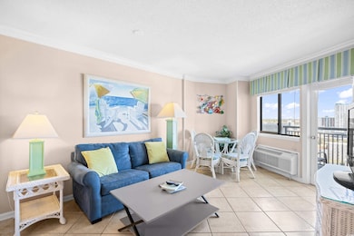 Living room with baseboards, an AC wall unit, orna
