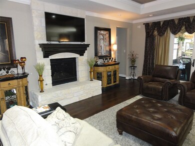 Gorgeous stone fireplace and views to the back roo