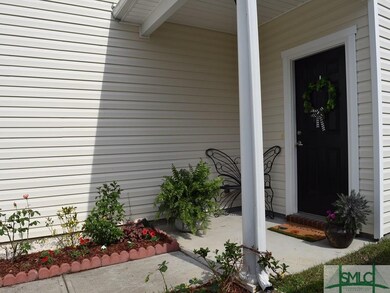 Entranceway to home is inviting with beautiful pla
