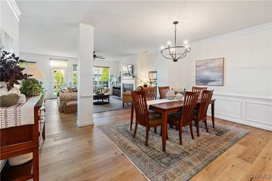 Dining room with notable chandelier, crown molding