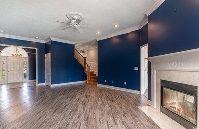 Unfurnished living room featuring a high end firep