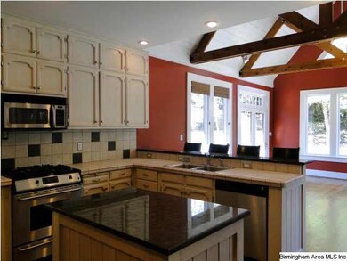 Kitchen with island and breakfast bar and it is op
