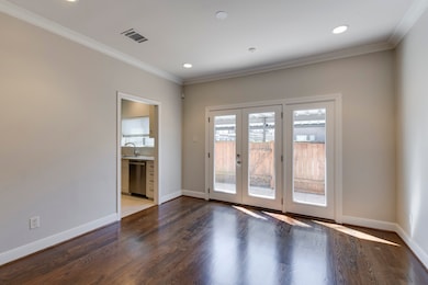 Glass paneled French doors let in the natural ligh