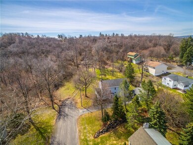 Over an acre on a dead-end street adjacent to Drum