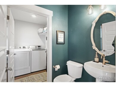 Main floor laundry is tucked behind powder room