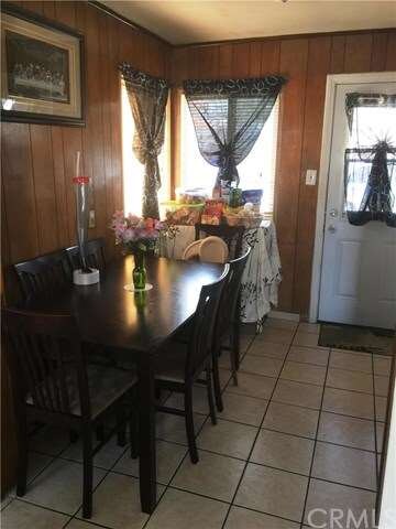 15735 Alwood - Dining area with door leading back to the car port area.