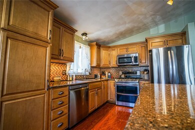 New kitchen with stainless appliances, and granite