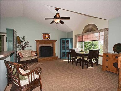 Living room features a gas fireplace and vaulted c