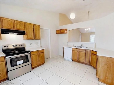 Kitchen with stainless steel electric range, under
