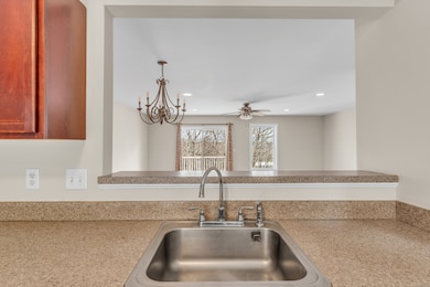 view from kitchen to dining area and family room