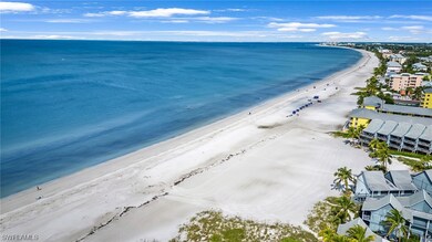 Wide sugar sand beach a block from lot.