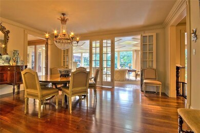 Formal dining looking onto sunroom