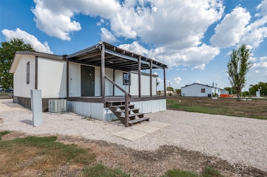 Rear view of house featuring a porch