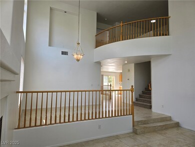 Staircase with a towering ceiling