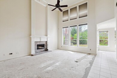 Vaulted living area with fireplace overlooking the