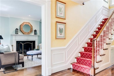 Enter left into the formal living room with a fire