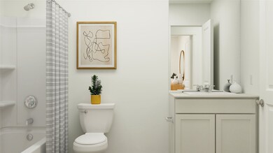 Bathroom featuring shower / bathtub combination with curtain and vanity