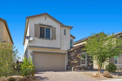View of front of home featuring a garage, stucco s