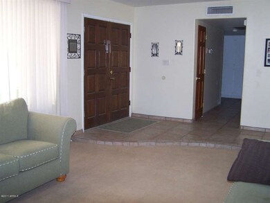 Double Door entry into Tile Foyer