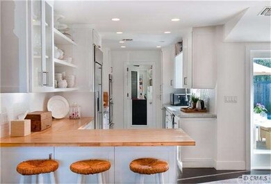 Butcher block, glass and open shelving