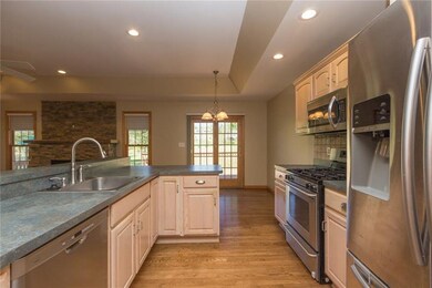 Hardwood, stainless steel, gas stove, dishwasher a