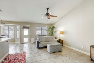 Family room at rear with lots of windows to the ya
