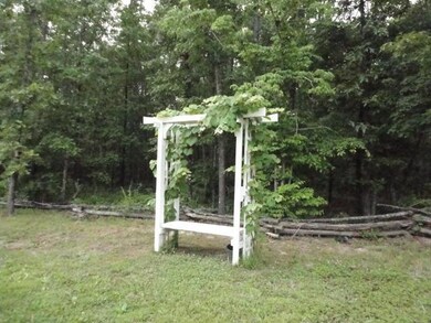 Another view of the land showing the split rail fence
