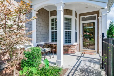 Covered front porch with stone accent. 