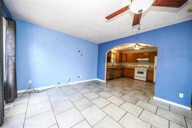 Living Room opens to eat in kitchen.