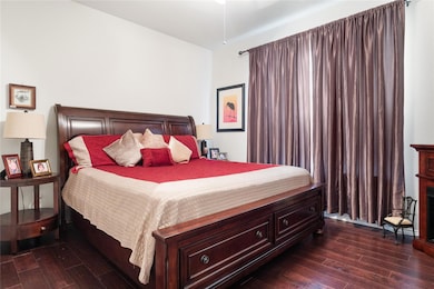 Front guest bedroom featuring dark hardwood / wood