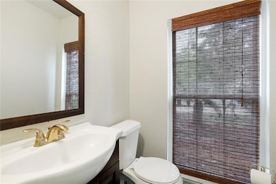 Half bath accessible from the first view of the ma