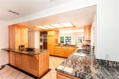 An open concept with kitchen located in center of 