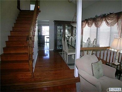 Enter thru custom mahogany doors onto hardwood flo