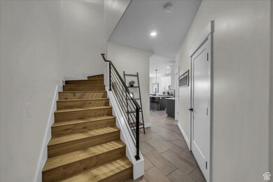 Stairs featuring recessed lighting and baseboards