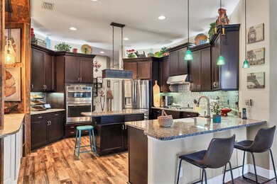 Gourmet kitchen with built and gas range.