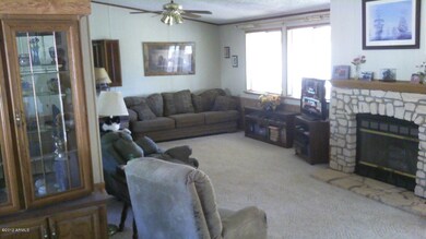 Living area of great room with fireplace