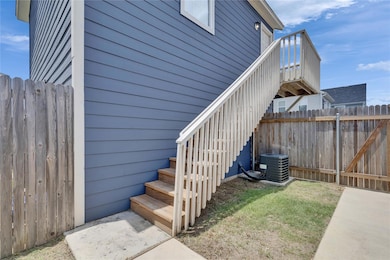 View of property exterior with stairway and a cen