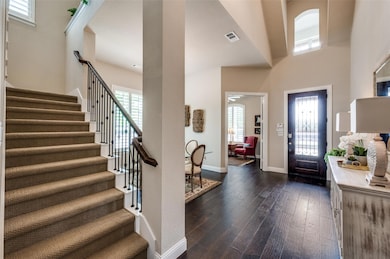 Sophisticated entryway boasting soaring ceilings, 