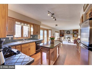 Kitchen offers abundant cabinetry, decorative trac