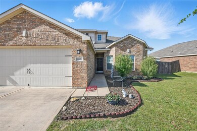 View of front of house with concrete driveway, a f