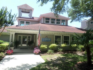 View of front of home with french doors, roof with shingles, and covered porch